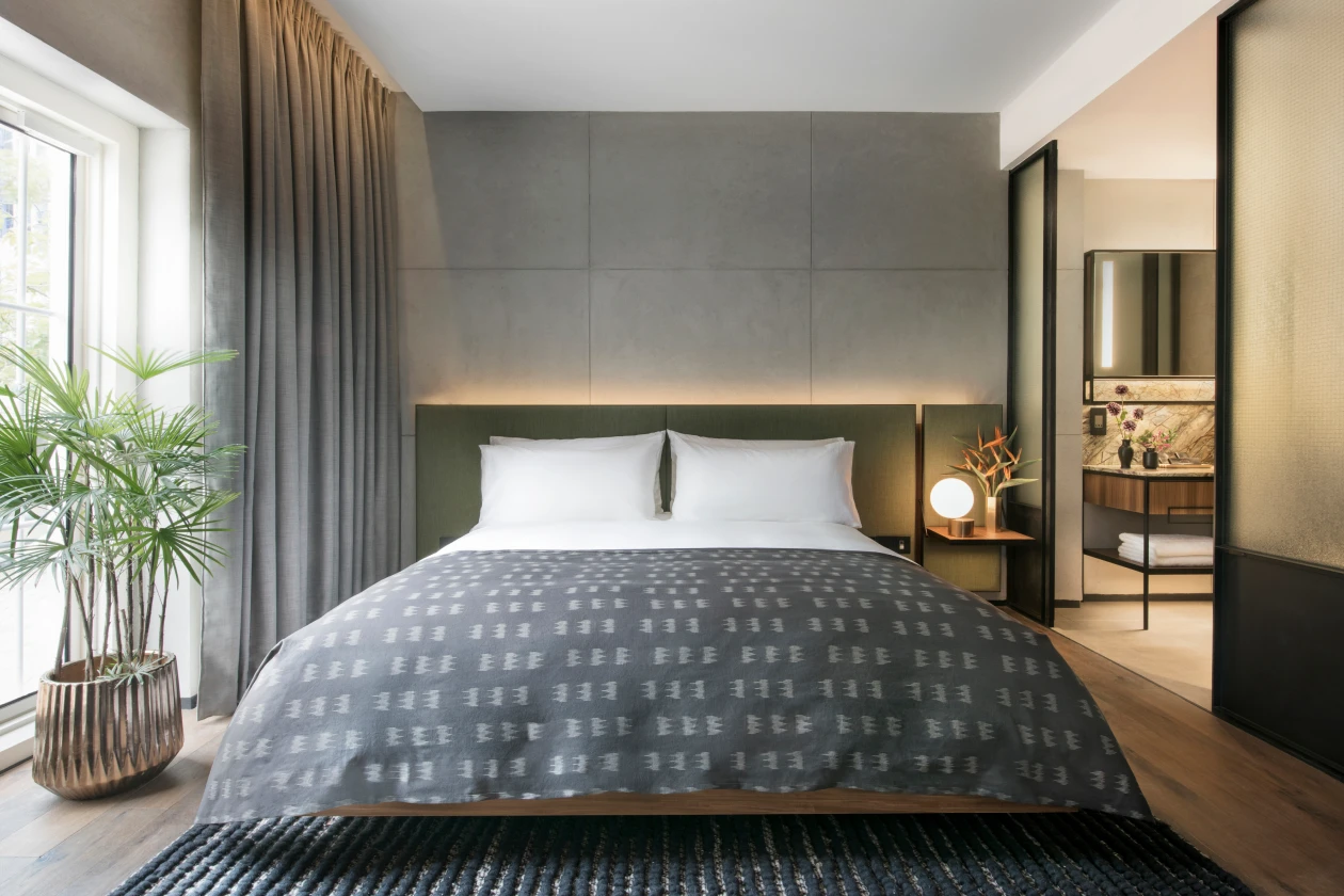 modern hotel bedroom with dark interior