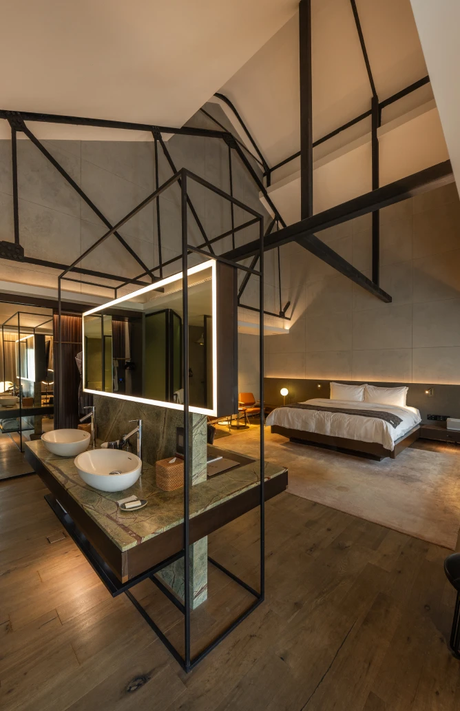 post-suite-indulgence-1-1 industrial-style hotel bedroom with grey accents