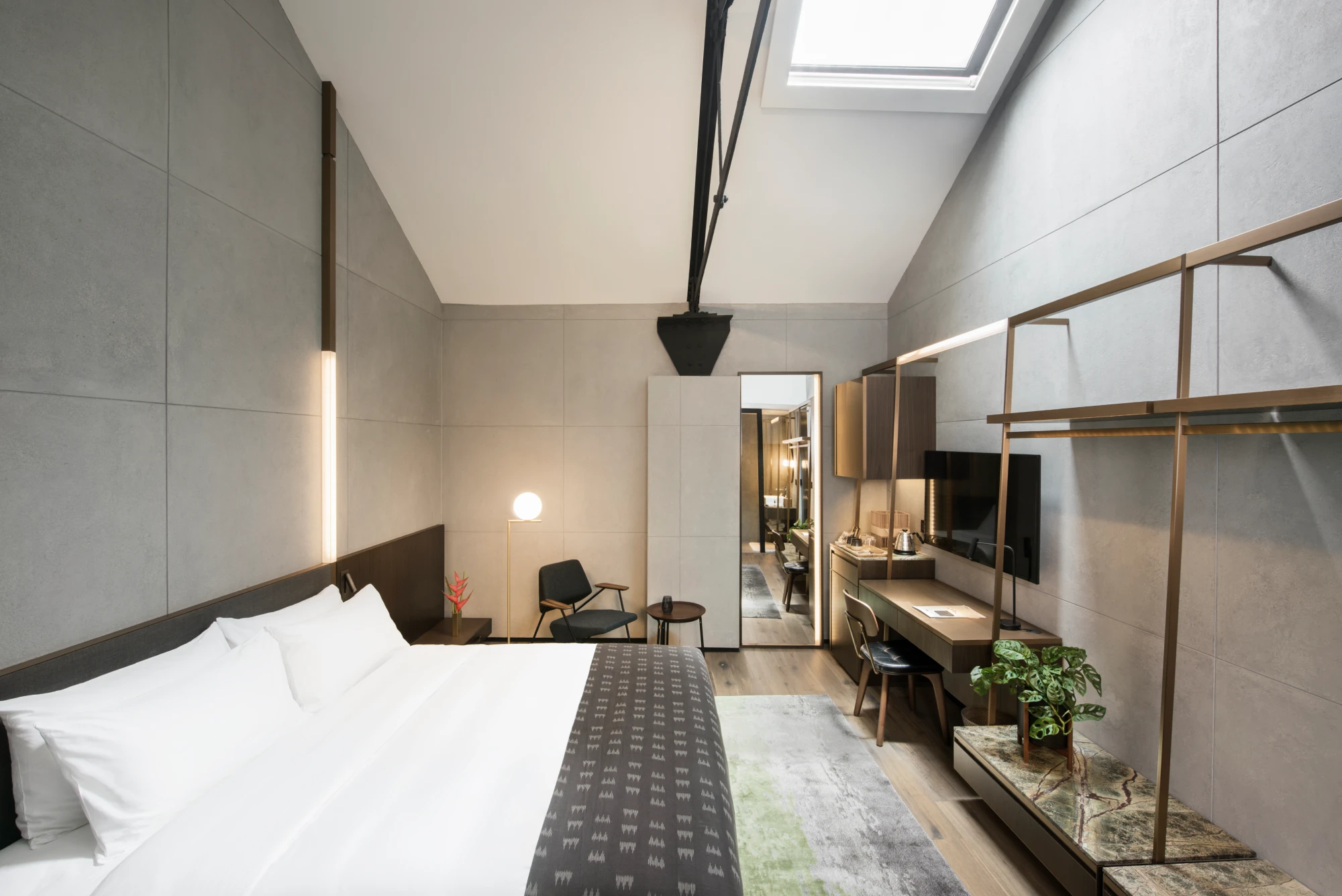 room-wl-carousel-4-1 modern hotel bedroom with skylight above the warbdrobe