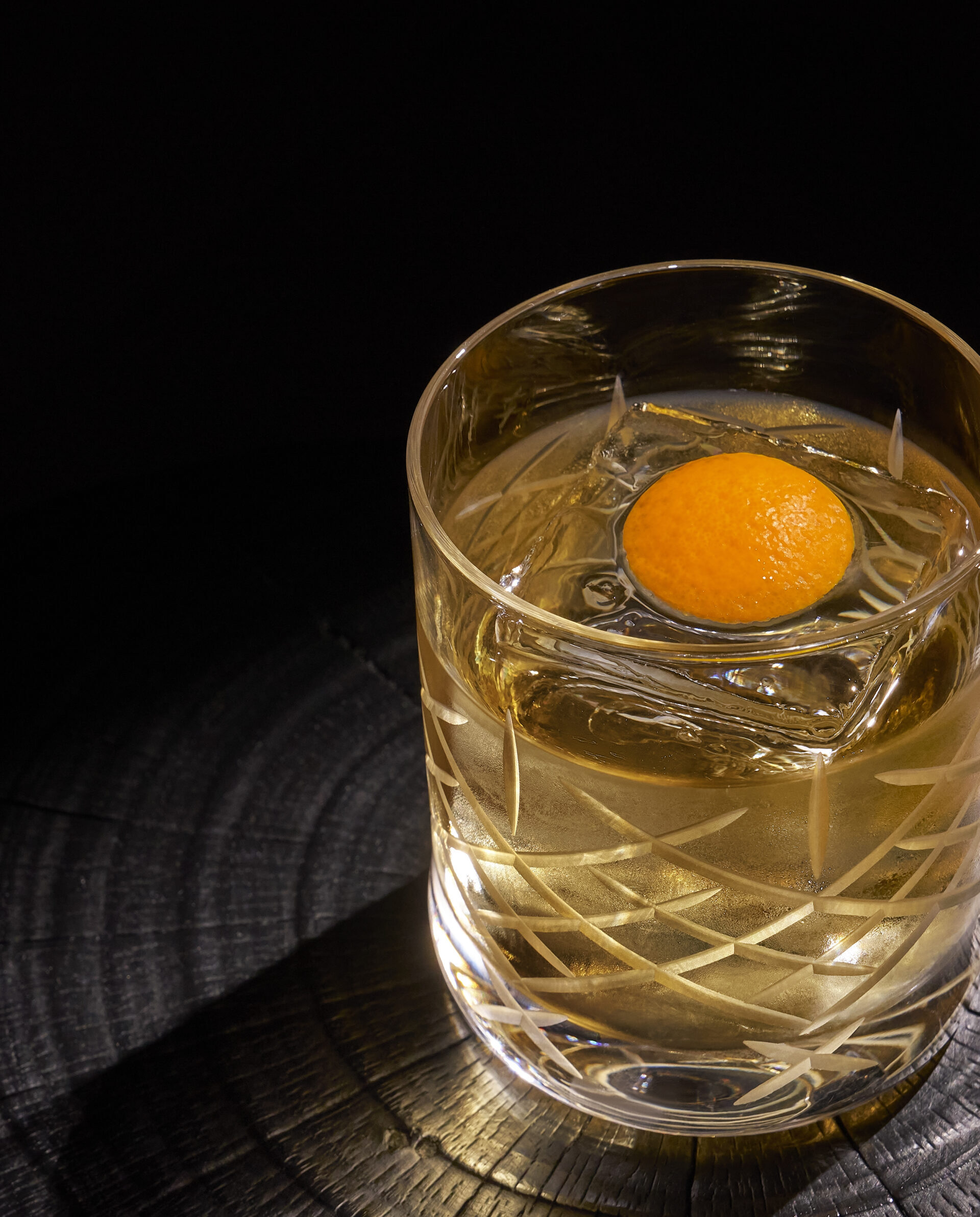 20250716_SC_TWH-Lobby Bar-0557 drink in a glass with an orange peel inside