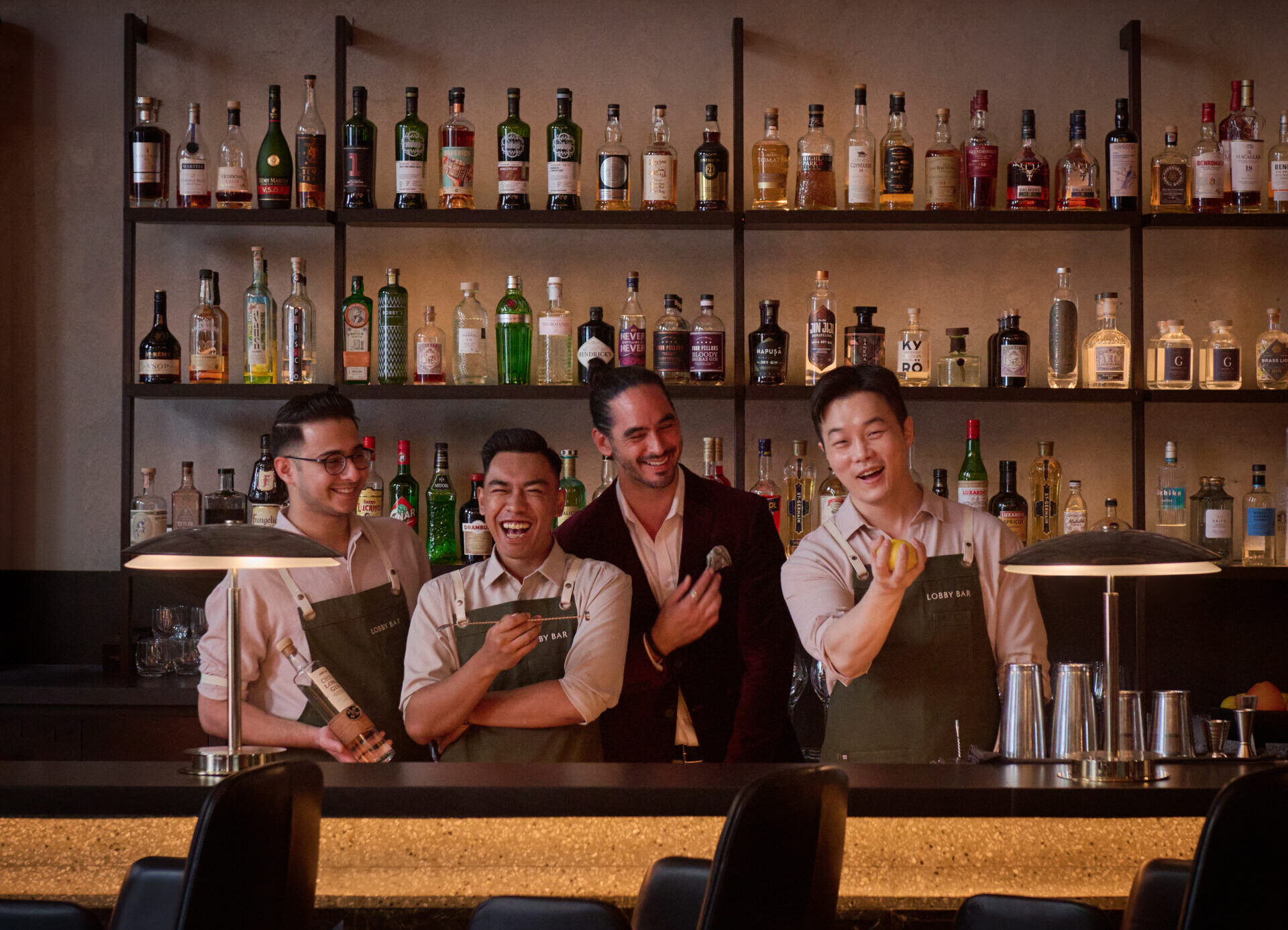 HIRES JOSEPH & BAR TEAM 923 four men behind a bar counter smiling for the camera